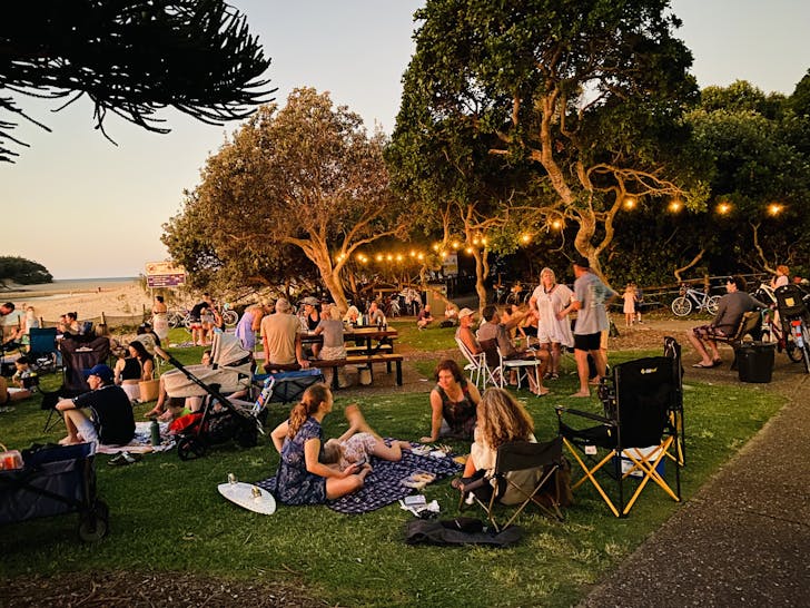 People sitting in park under lights