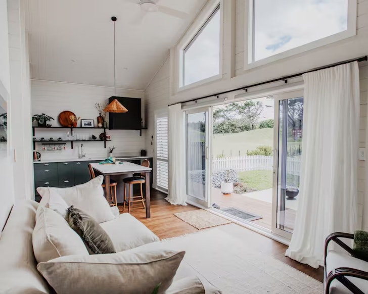A view of the living space at Picturesque Beach Getaway one of the best beach house Airbnbs NZ