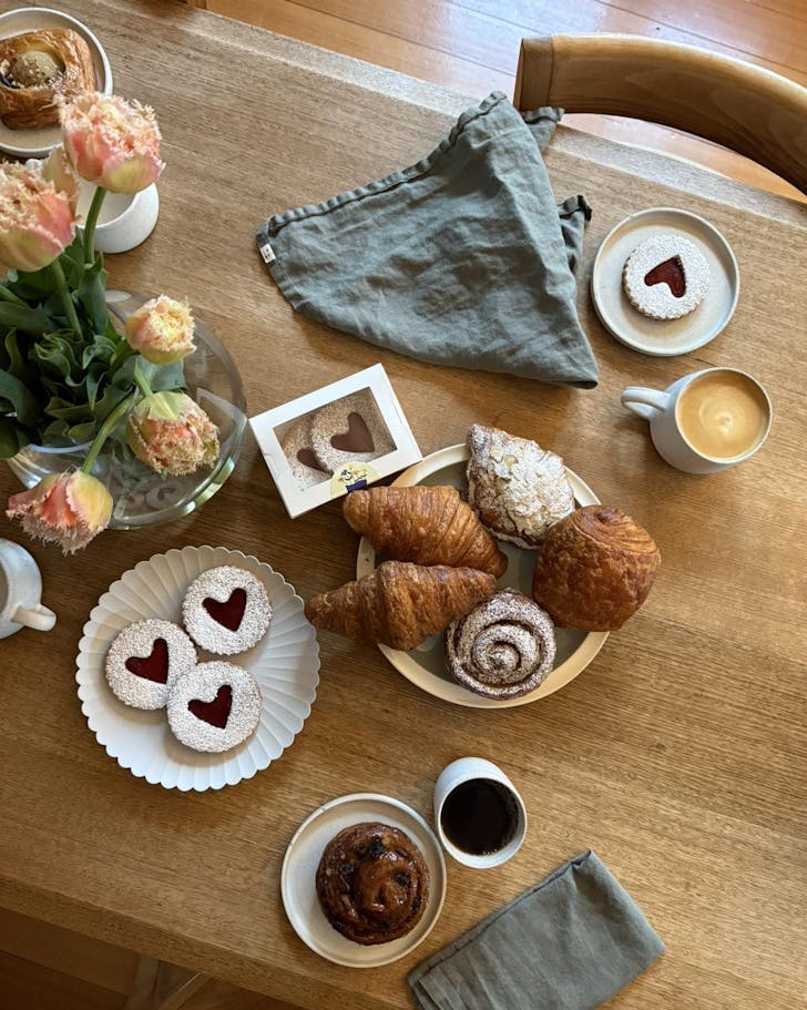 Coffee and pastries on table.