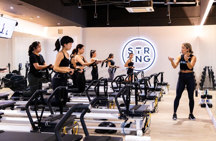 Women doing a Pilates class at STRONG Pilates