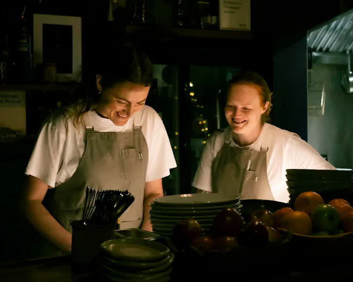 Plabita and Kate work in the kitchen at Forest. 