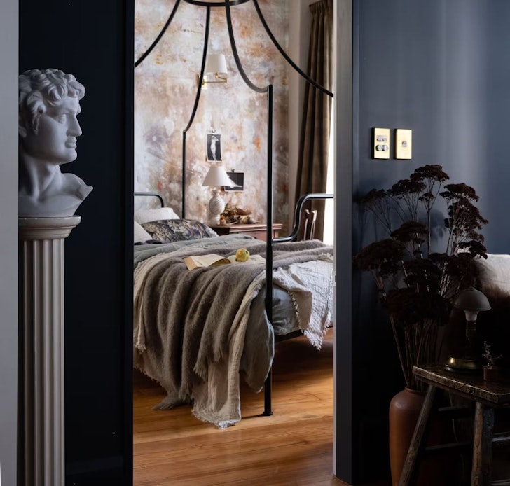 The four poster bed at Plimmer Bolthole one of the most romantic stays in New Zealand