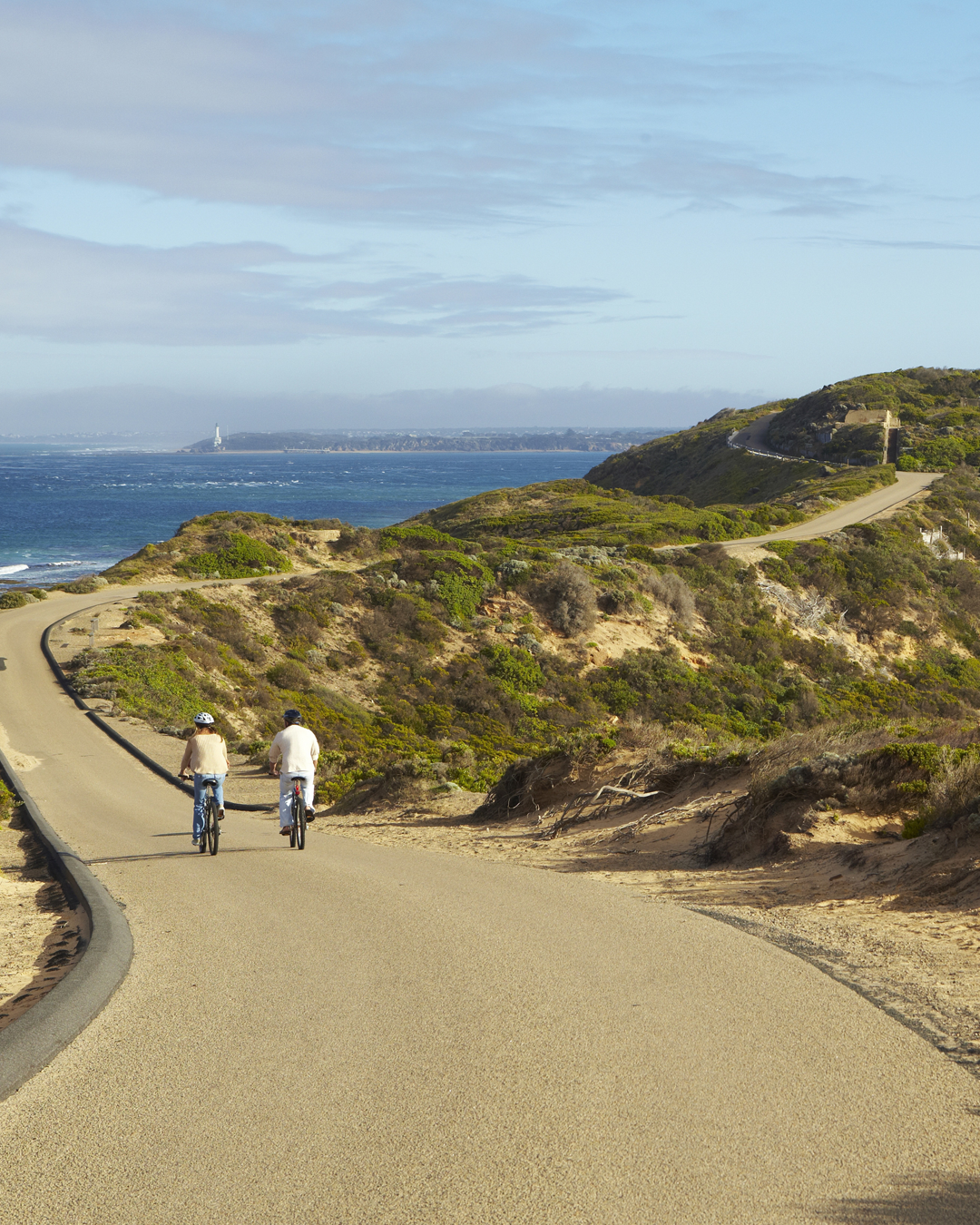 Two people cycling down a track at one of the best walks in Victoria.