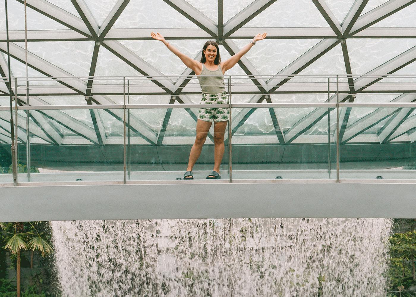 Polly Markus in front of the HSBC Rain Vortex at Jewel Changi Airport
