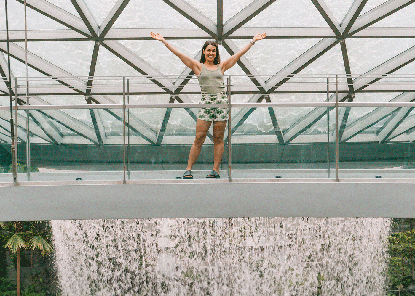 Polly Markus in front of the HSBC Rain Vortex at Jewel Changi Airport