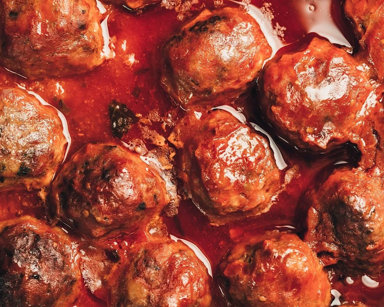 Chunky meatballs slathered in red sauce. 
