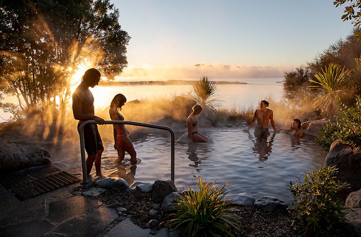 People step into a beautifully steaming spa at the Polynesian Spa in Rotorua.