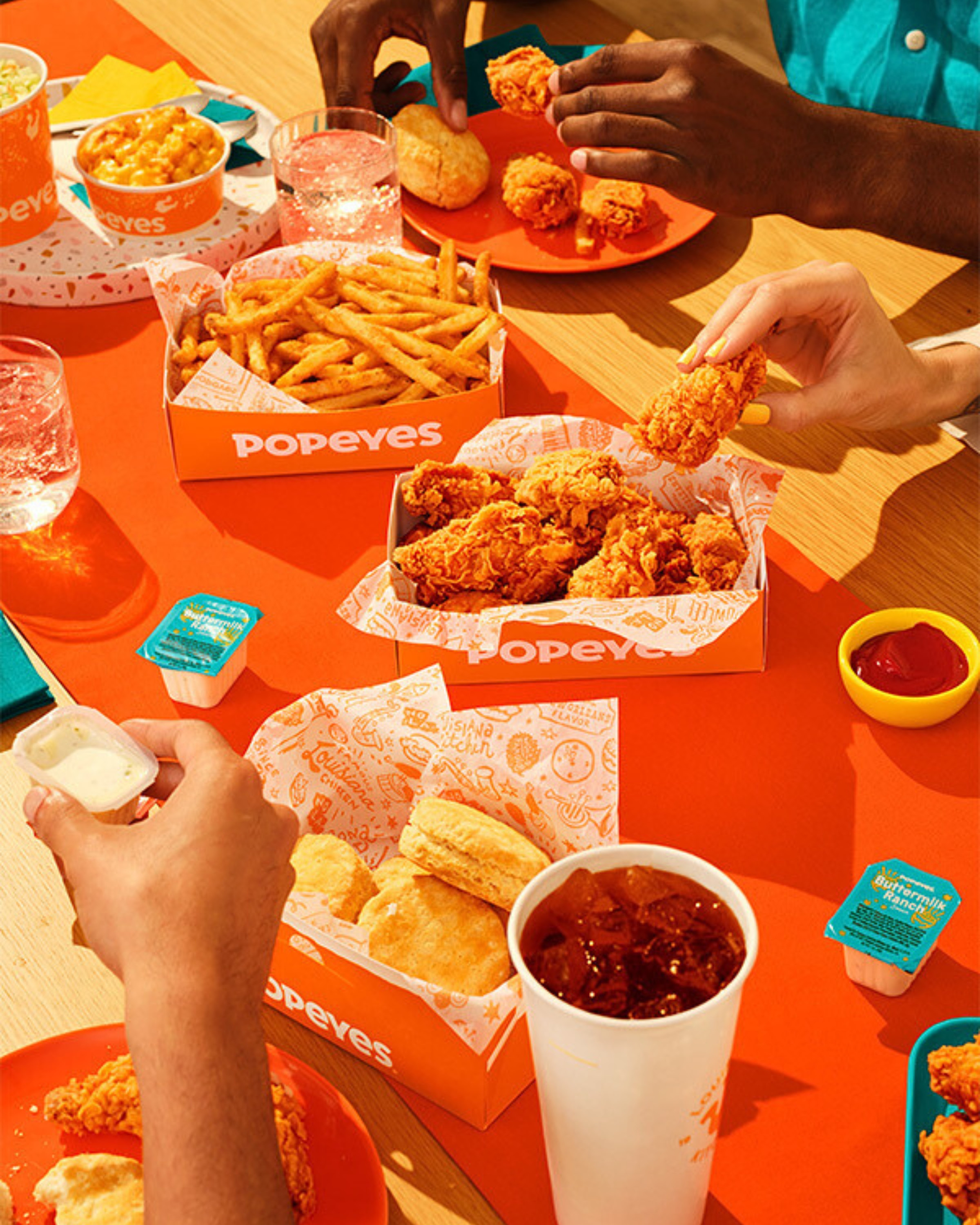 Table of food from fried chicken chain Popeyes that will soon open in New Zealand