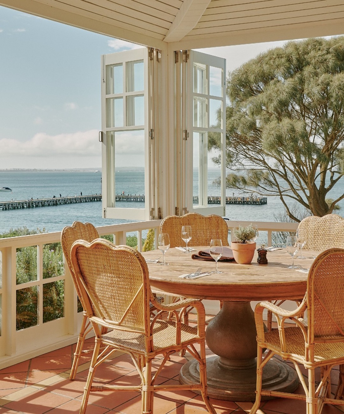 Terrace windows open up to a breathtaking ocean view.