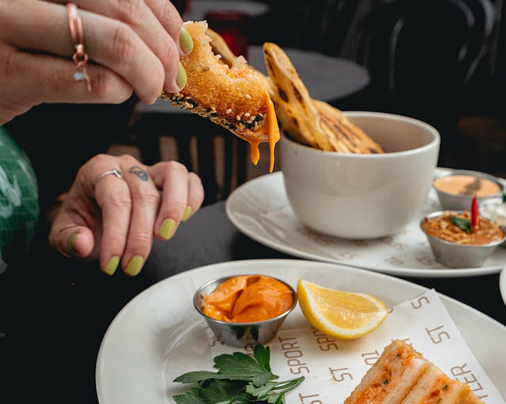 Kathryn Steane dunks prawn toast into gochujang aioli at Portside. 