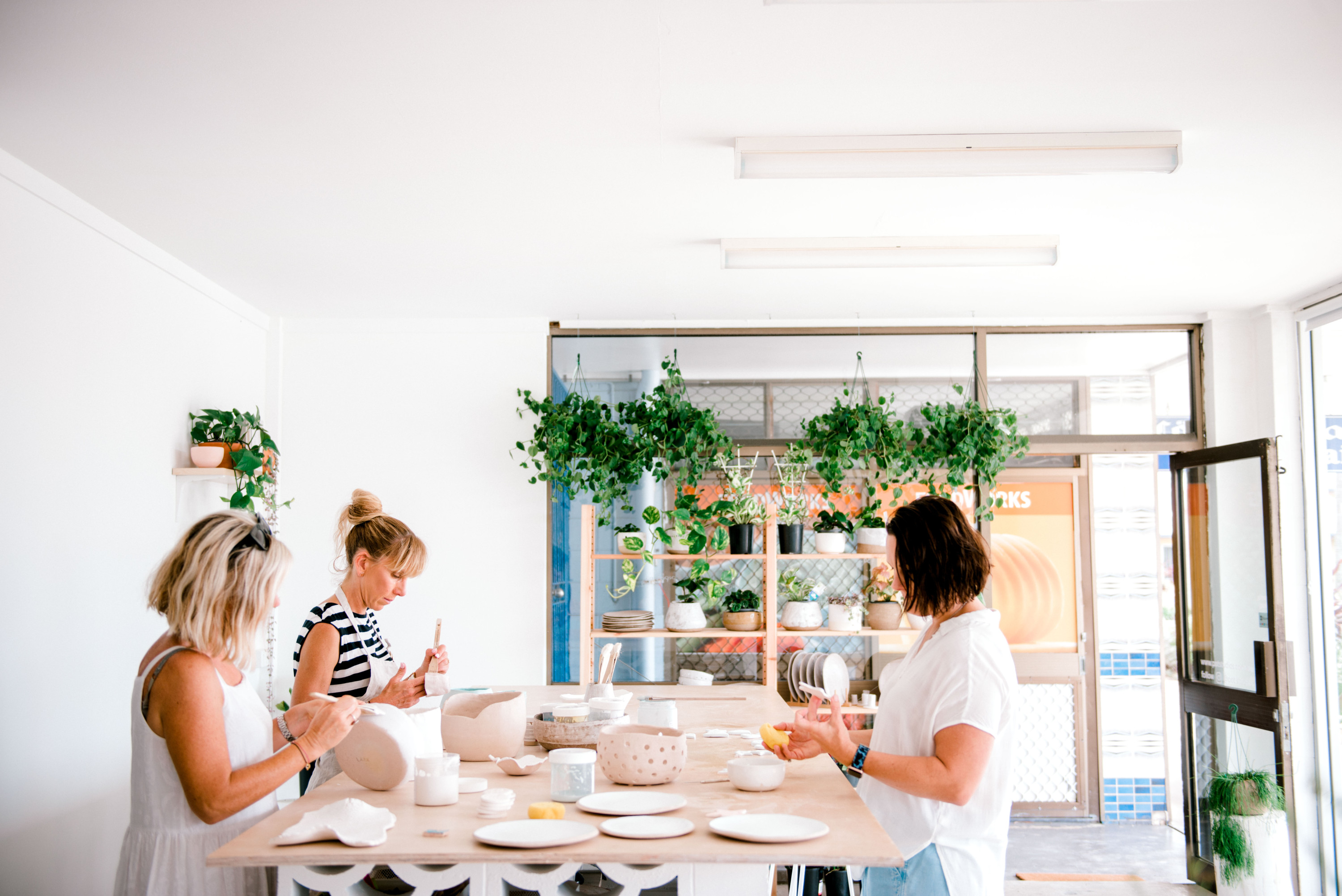 three women at one of the Gold Coast's best pottery studios