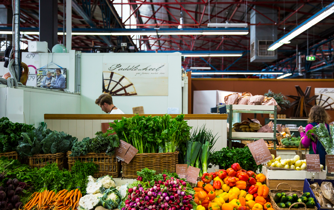 A busy market stall with fresh produce, one of the best markets in Melbourne. 