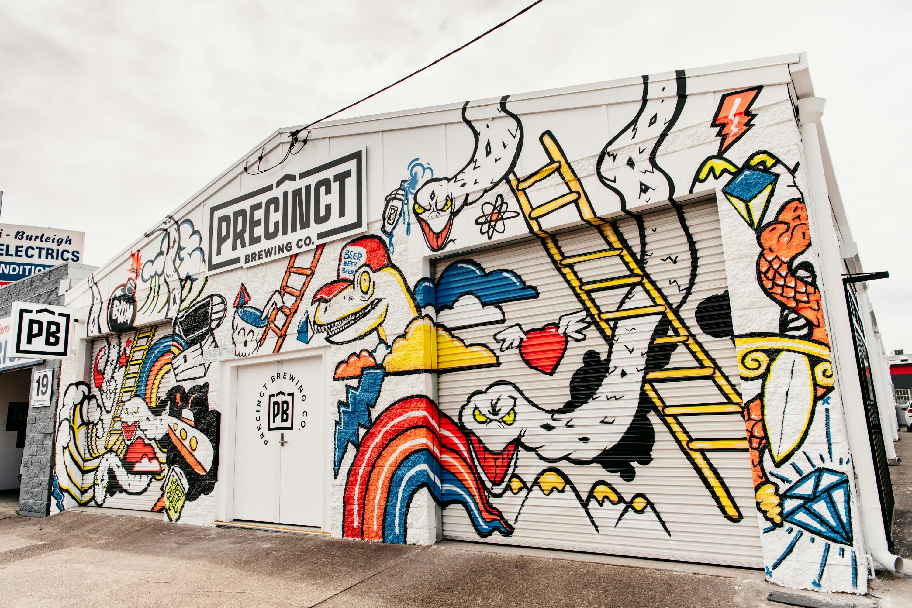 the graffitied exterior of miami's precinct brewing co