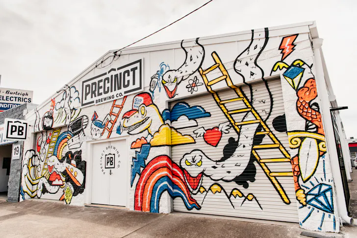 the graffitied exterior of miami's precinct brewing co