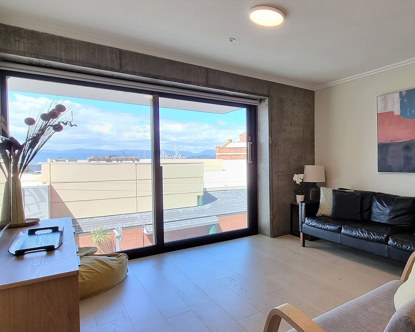 One of the best airbnbs in Wellington, this image is a view of of the inviting king beds at the Premium City Apartment in Thorndon.