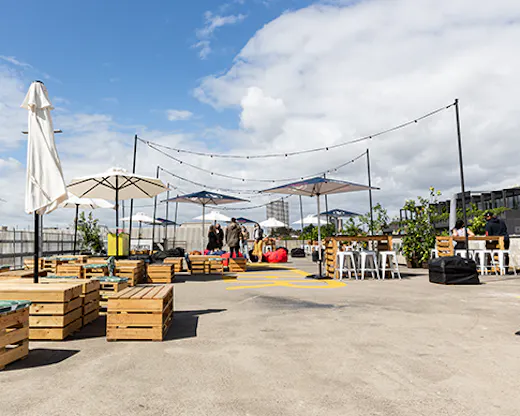 A rooftop bar set up on a carpark.