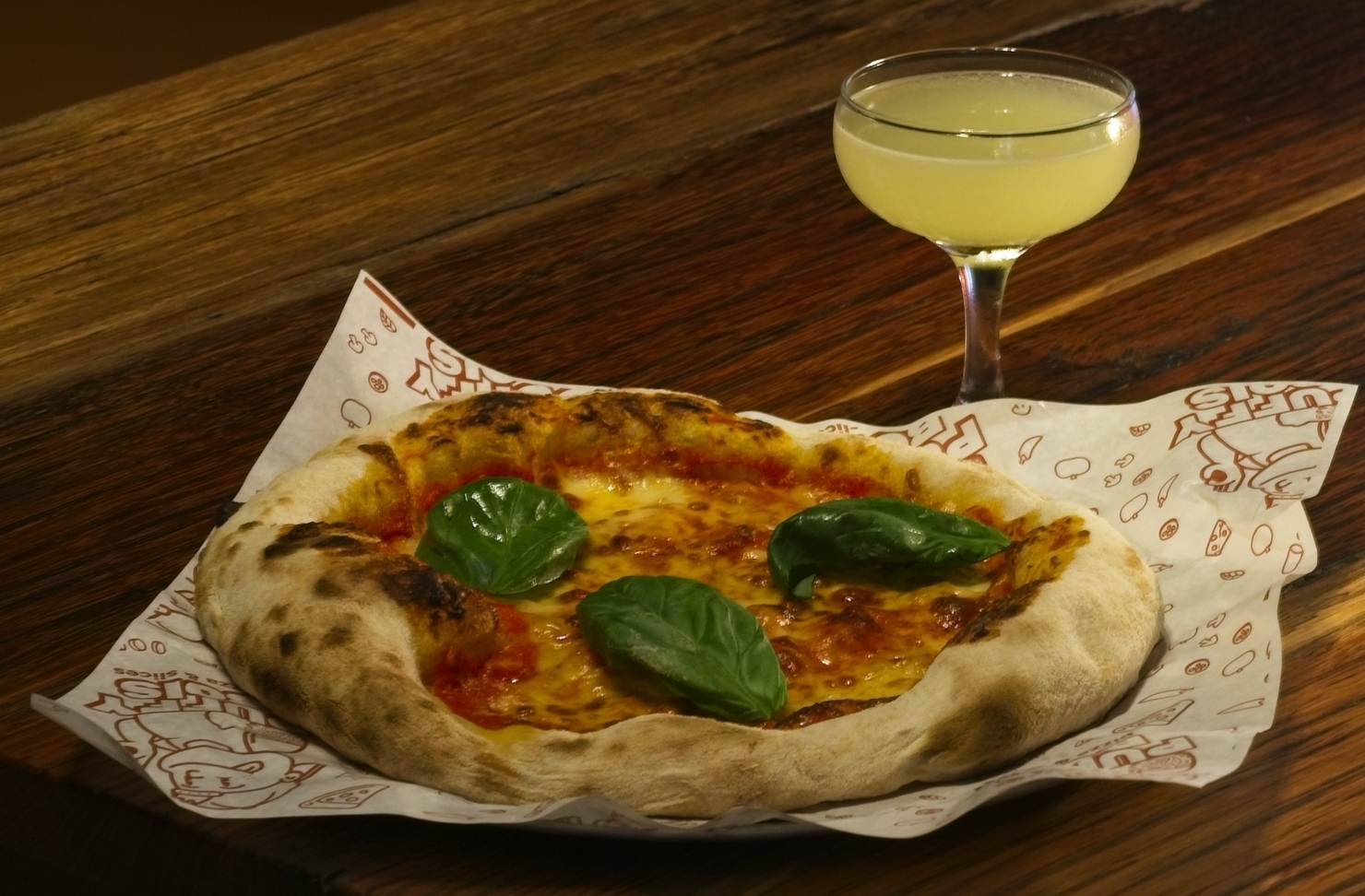 A pizza and cocktail from Puffy Bois