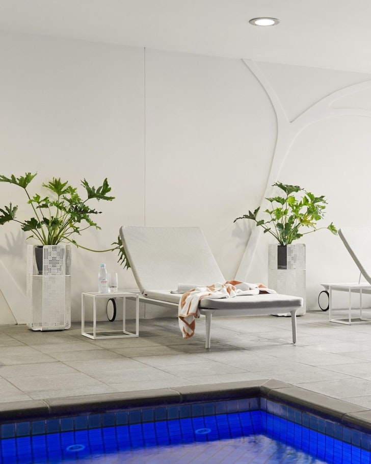 A lounger by the pool at Pullman Adelaide one of the best Adelaide hotels