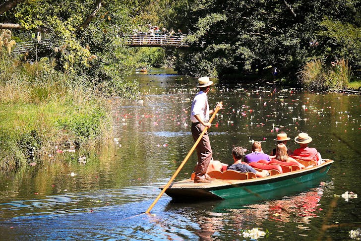 People being punted along on the Avon River in Christchurch