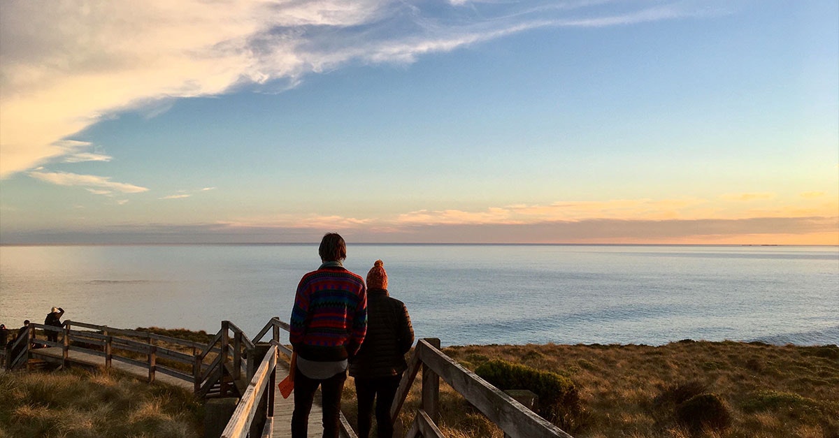 A couple walks along the Pyramid Rock boardwalk.