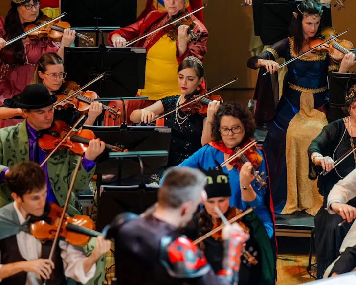 Dressed up characters playing violin