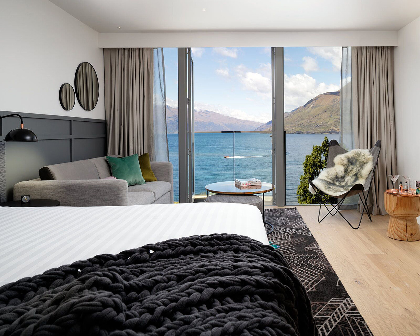 A king bedroom suite looks out across Lake Wakatipu. 