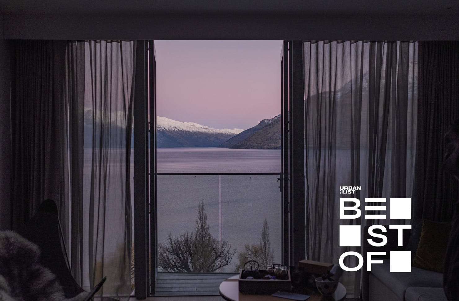 A view over the lake and snow-capped mountains at QT Queenstown, one of the best hotels around.