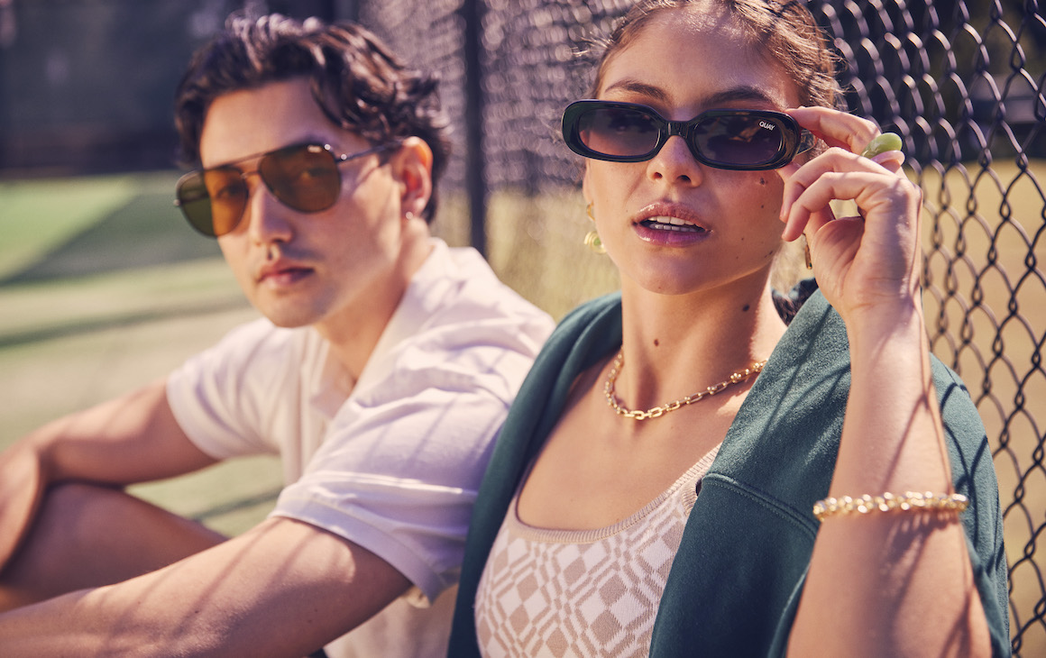 a male and female model wearing Quay sunglasses