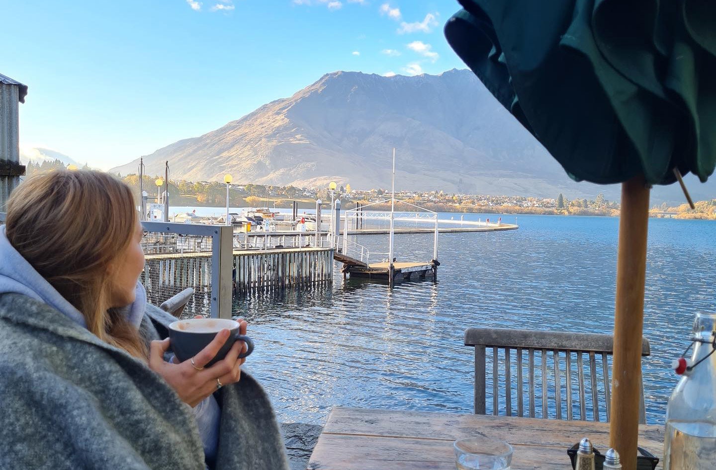 Someone looks out at the view at The Boat Shed Cafe & Bistro.