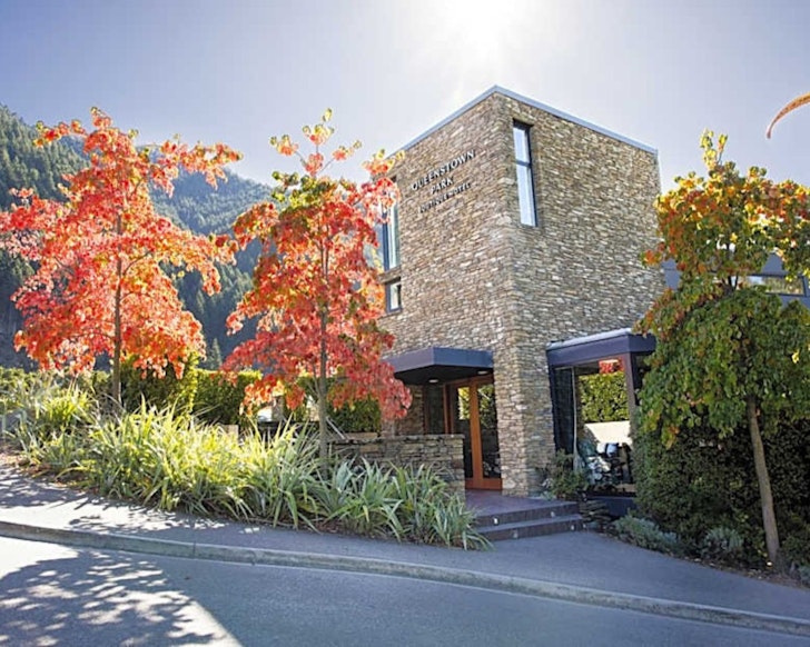 The stone exterior of Queenstown Park Boutique Hotel 