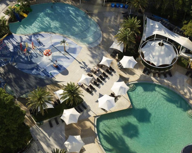 An aerial view of the pool and playground at RACV Royal Pines Resort Gold Coast one of the best luxury resorts in Queensland