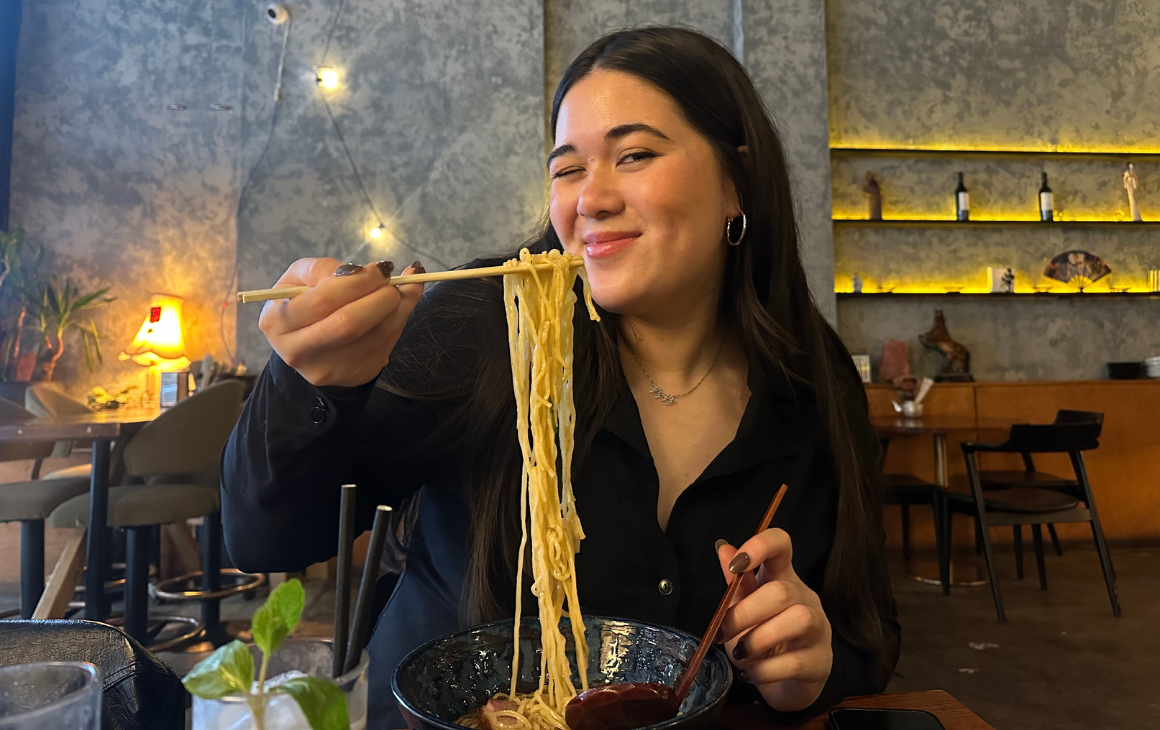 Woman eating ramen