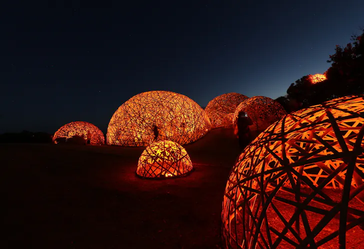 A collection of orange-lit domes.