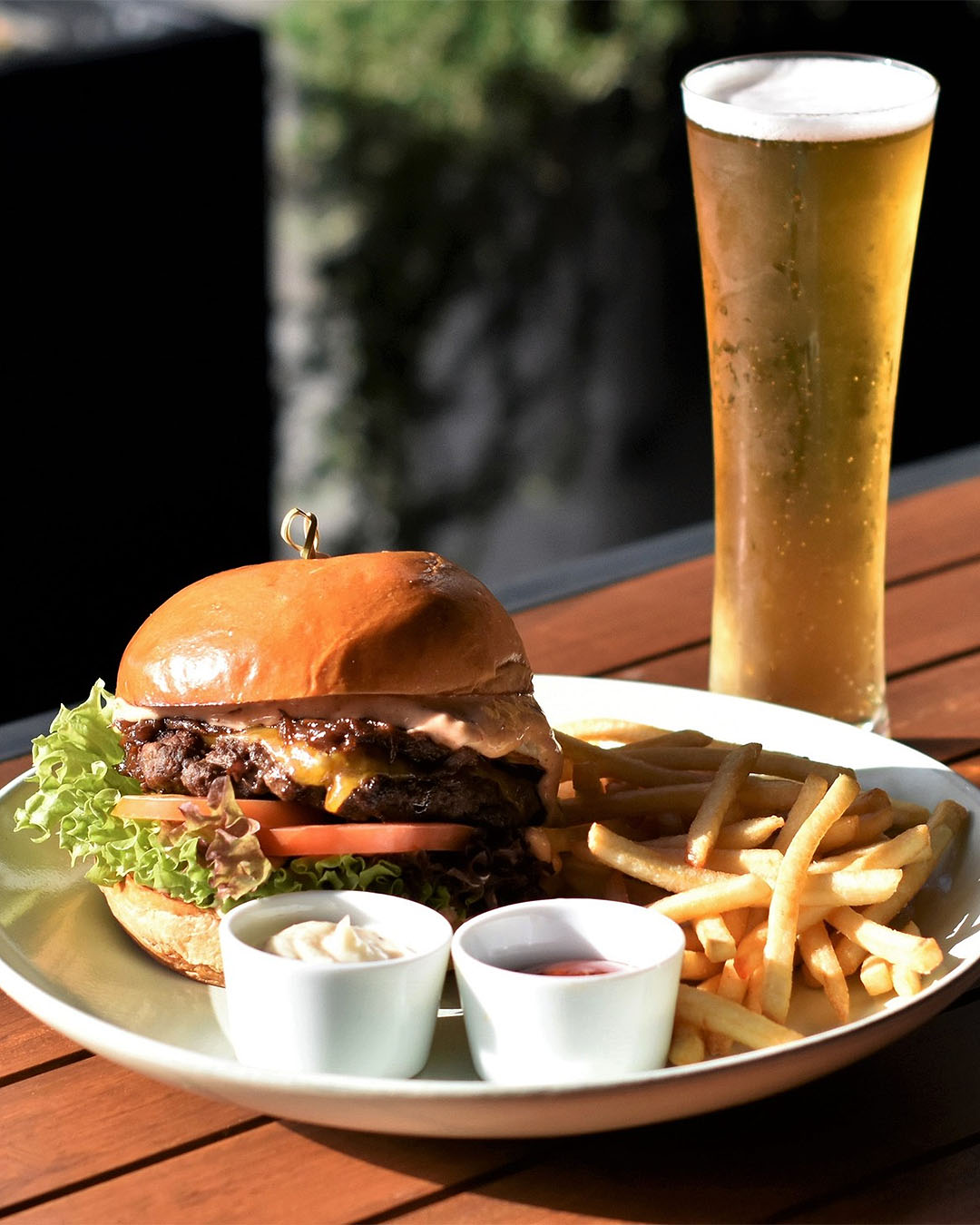 A gorgeous looking burger and beer in the sun at The Pantry.