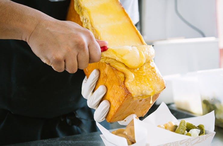 Raclette cheese being served