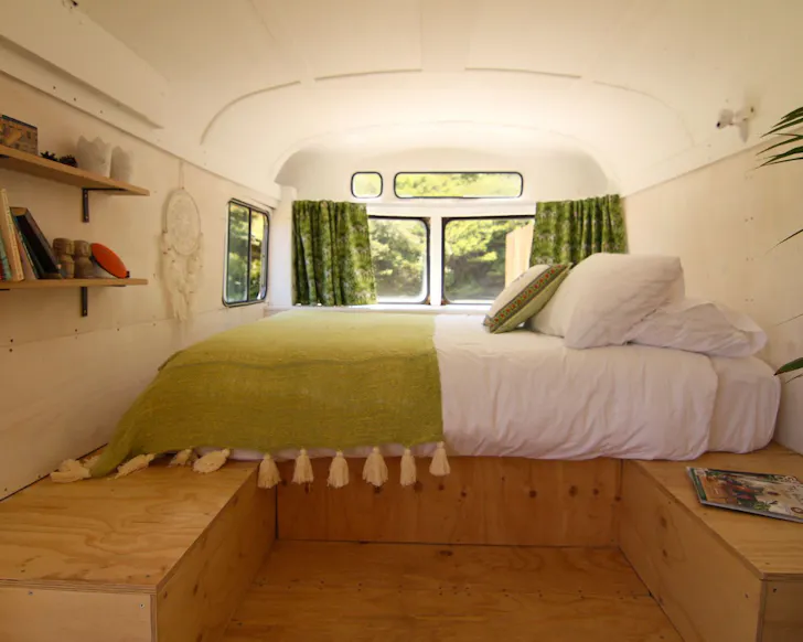The bedroom at Raglan LoveBus best tiny homes New Zealand