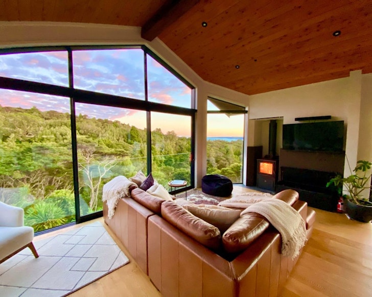 The lounge at Raglan Treetop Retreat best winter cabins New Zealand