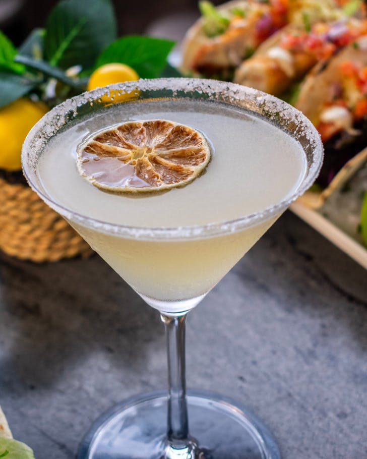 A salt-rimmed cocktail and tacos at Rambutan Rooftop Bar in Townsville. 