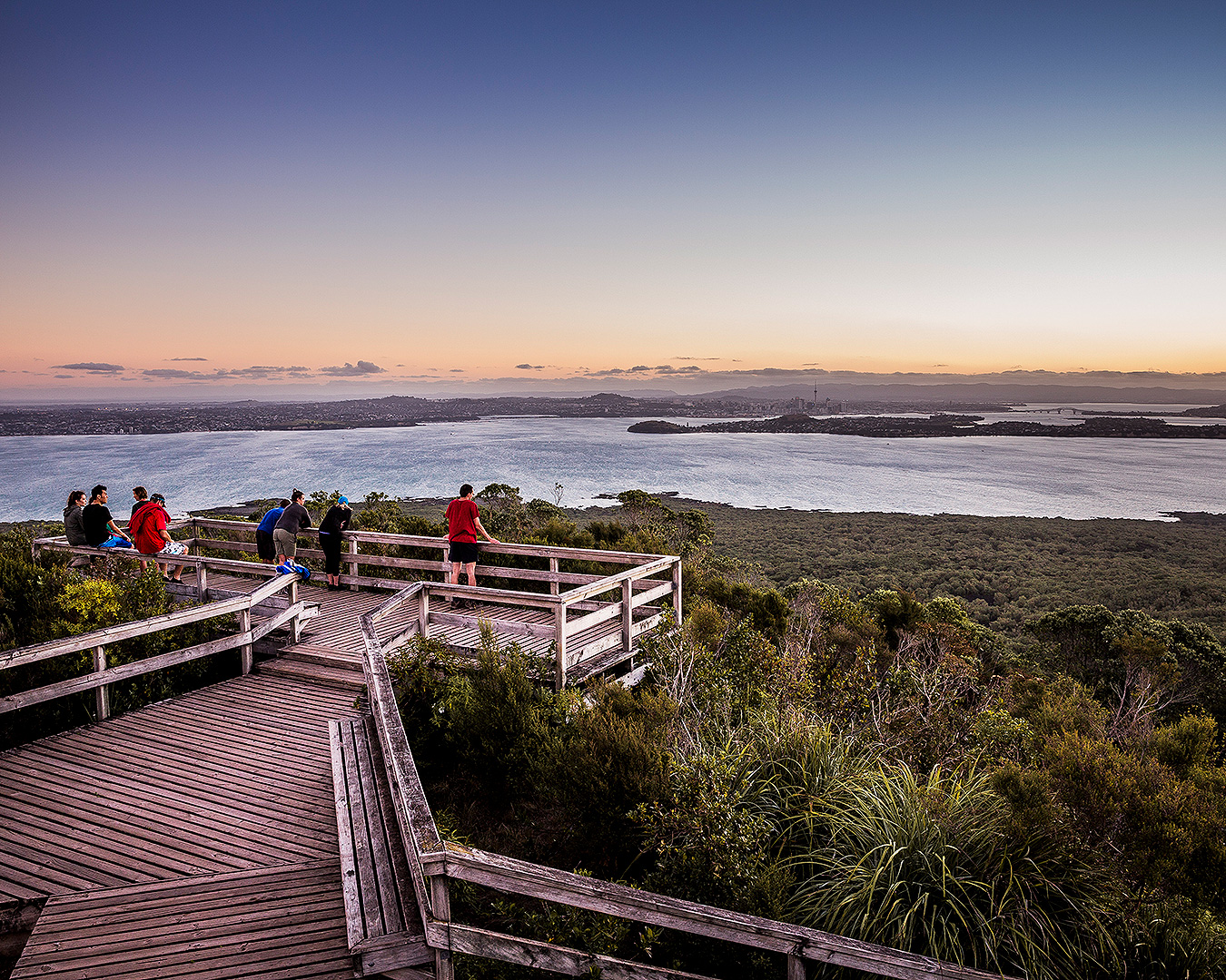 People stand at the summit of Rangitoto.