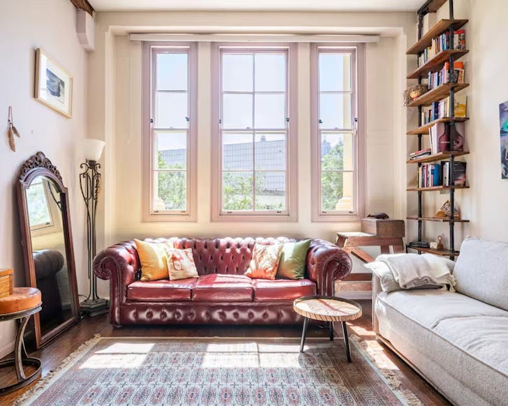 A view of a leather couch in the lounge at this short term stay in Pyrmont Sydney CBD