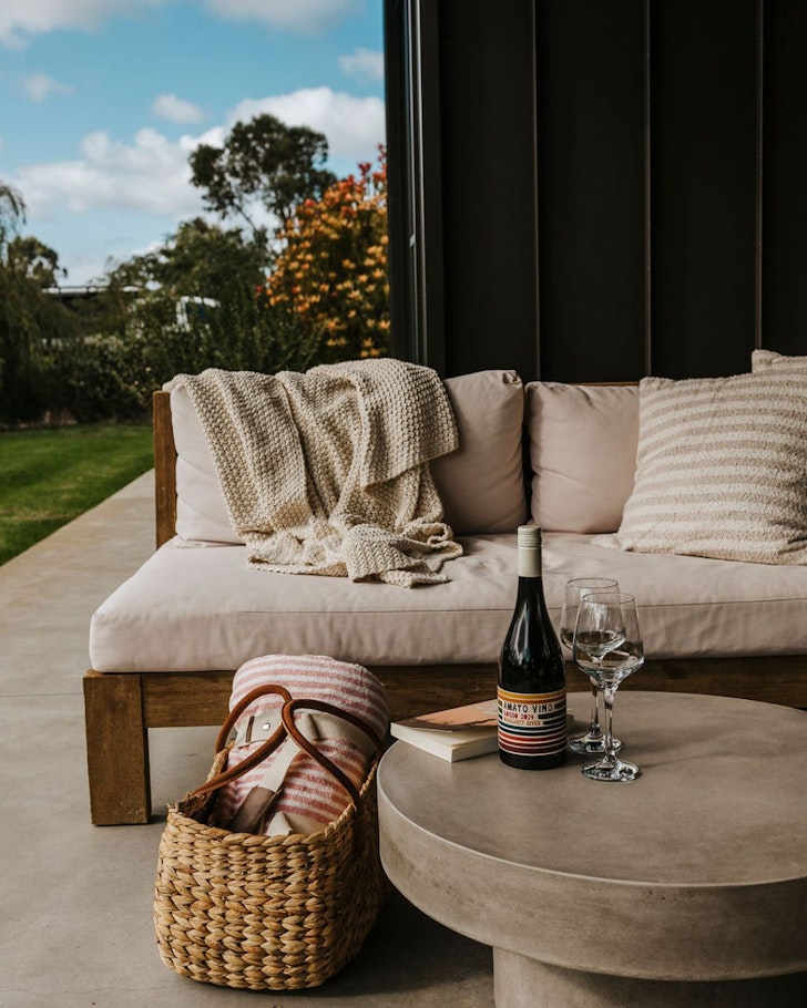 A cosy chair in the garden at Redgate Studio one of the best WA Airbnb stays 