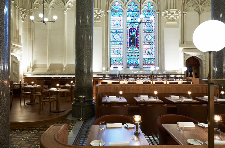 An empty dining room with grand pillars and gothic-style features at Reine and La Rue, a restaurant offering a set menu for mother's day in Melbourne