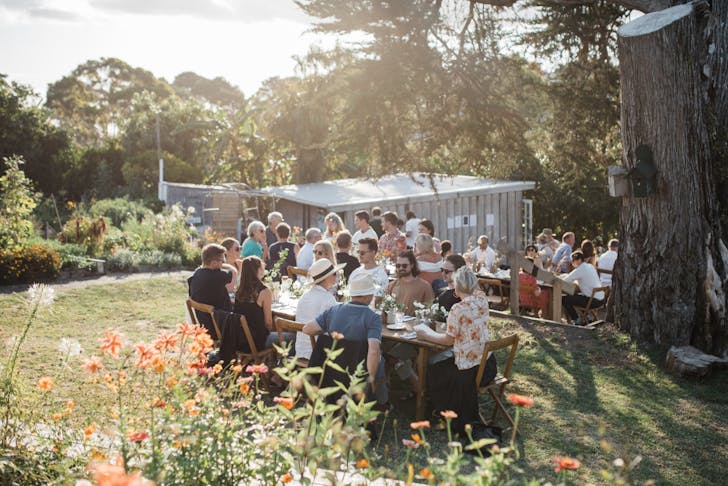 Guests dining at the outdoor urban farm
