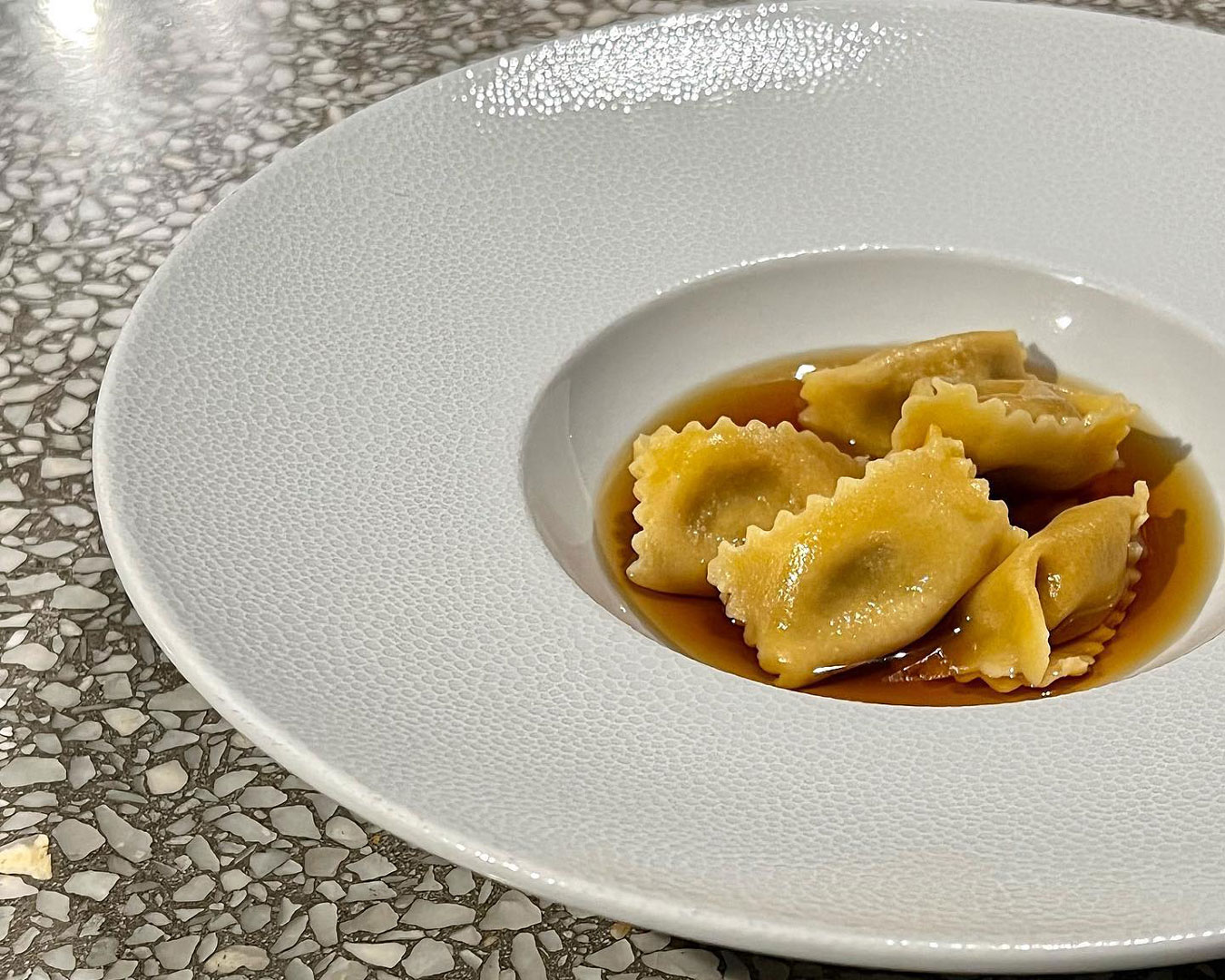 bowl of pasta on terrazzo table top