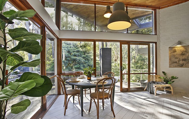 A large light filled room with plants, a top Lorne accommodation. 