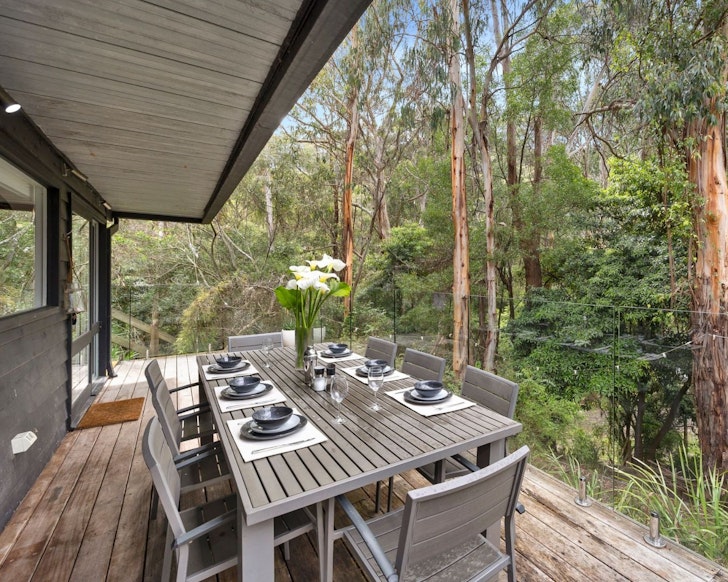 The outdoor dining area at River House one of the best Airbnb accommodation options Lorne