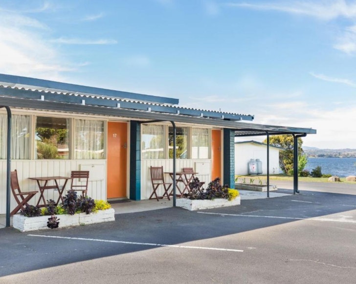 An exterior of view of Riverfront Motel & Restaurant by the water one of the best motels in Australia