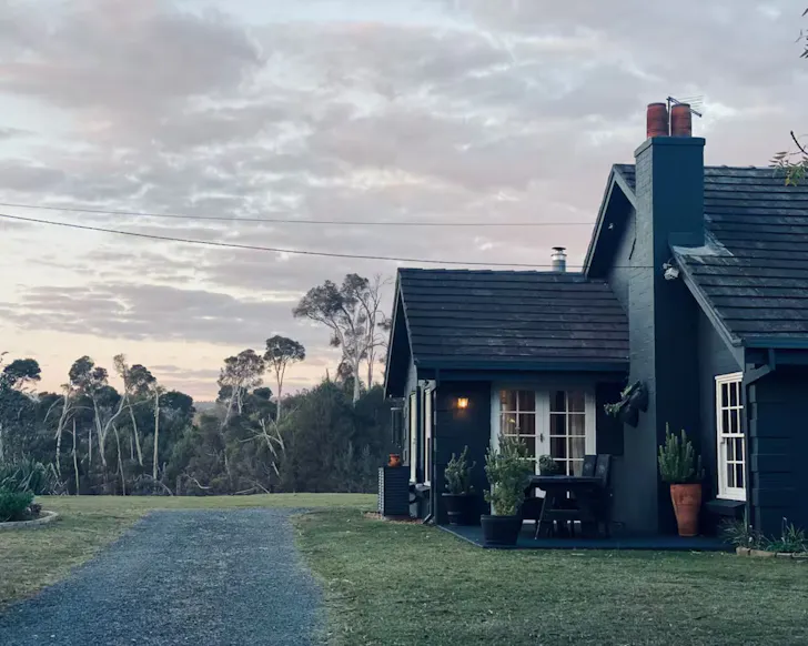 The black exterior of Rivers Edge Homestead one of the best kid-friendly Airbnbs in Australia