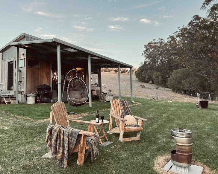 A view of the fire pit outside Riverside At Ryans Rest best tiny home stays WA