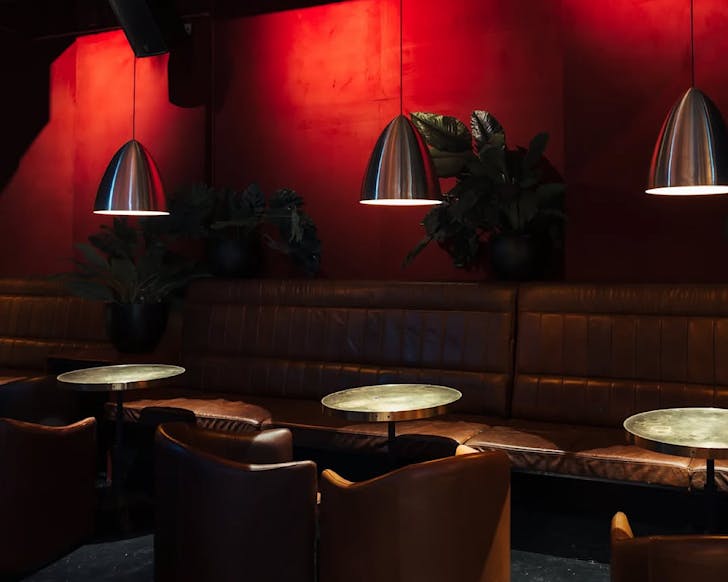 A red and chrome retro-futuristic aesthetic at Rocketman bar.